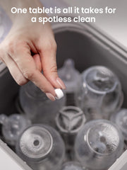 GROWNSY tablets dissolving in bottle washer demonstrating cleaning action