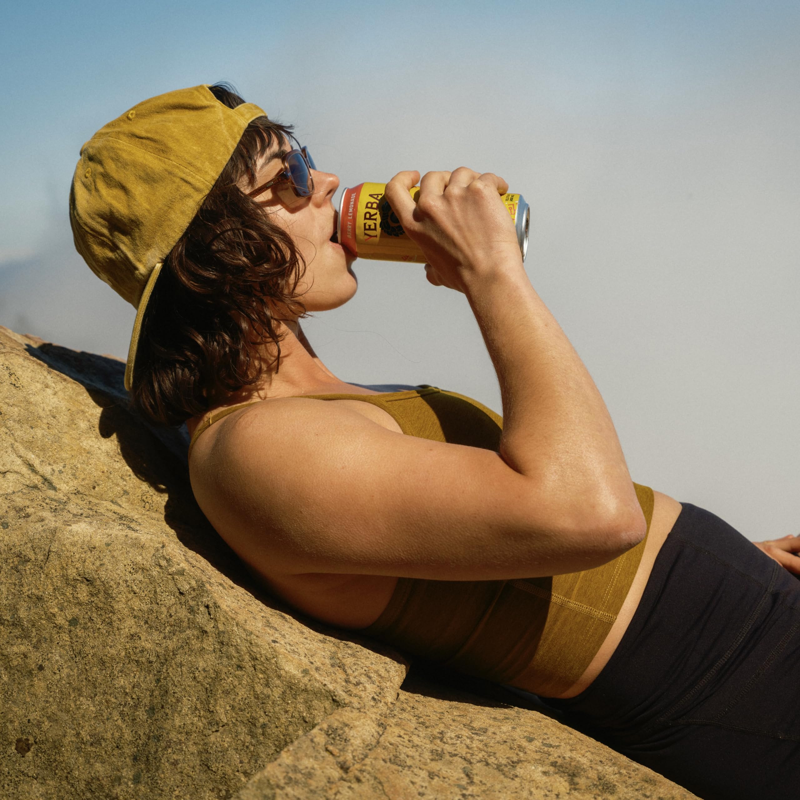Guayaki cans shared outdoors with friends showing community and restorative sourcing
