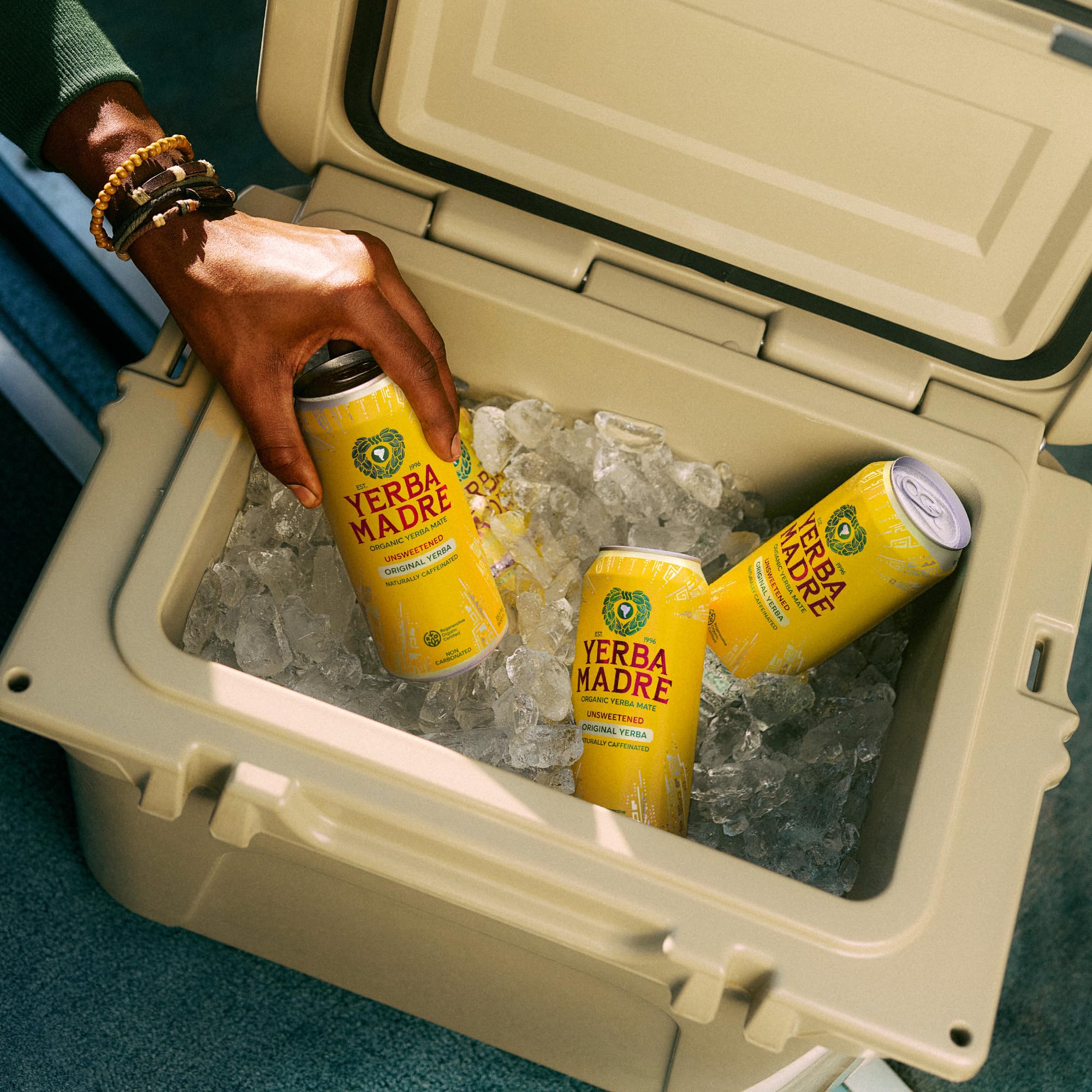 Guayaki can held in hand showing size and portability benefit