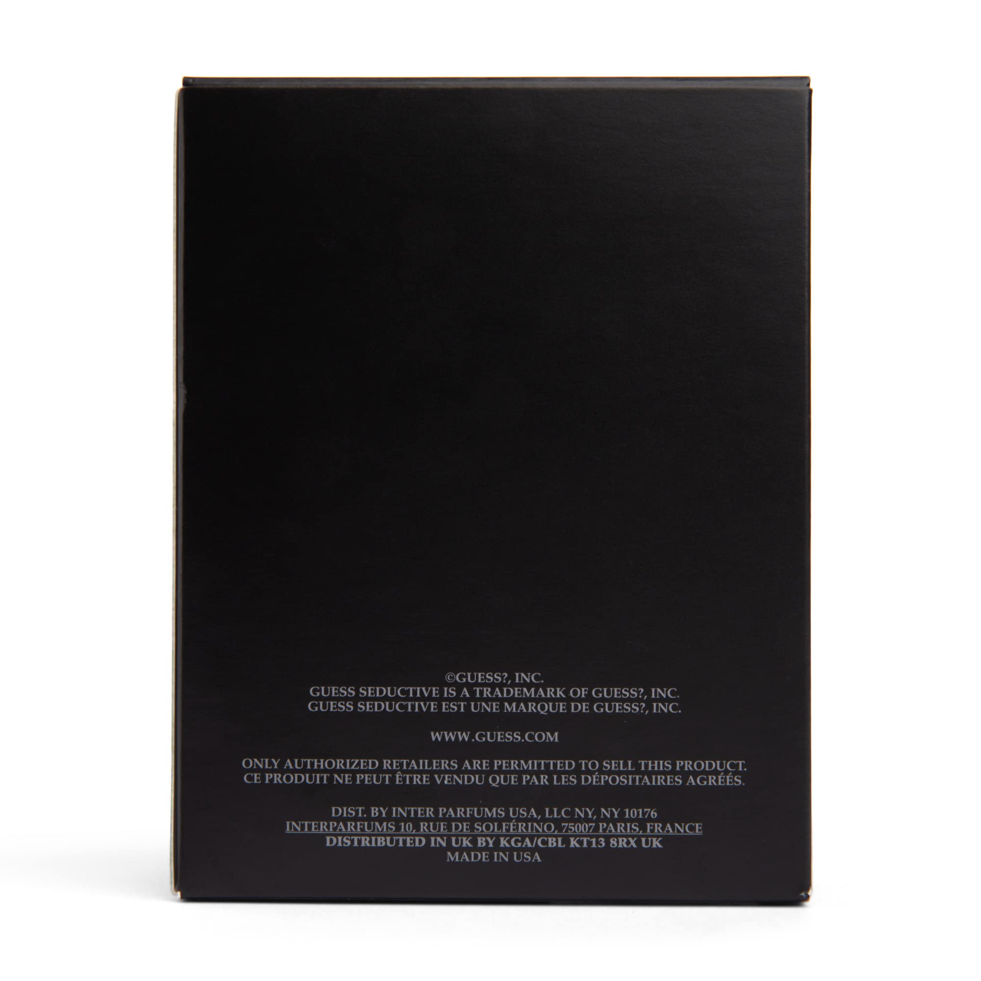 GUESS Seductive Homme Noir 3.4 oz bottle next to ruler to show actual size for buying clarity