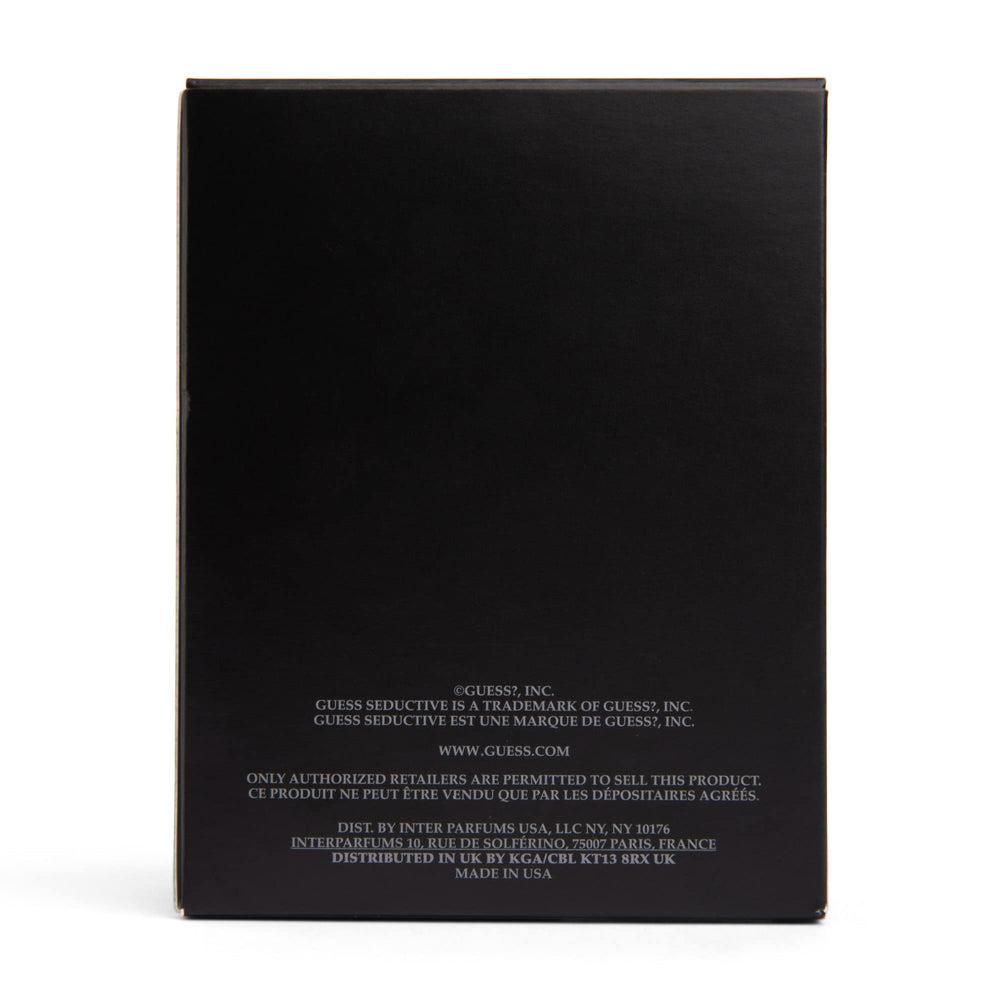 GUESS Seductive Homme Noir 3.4 oz bottle next to ruler to show actual size for buying clarity