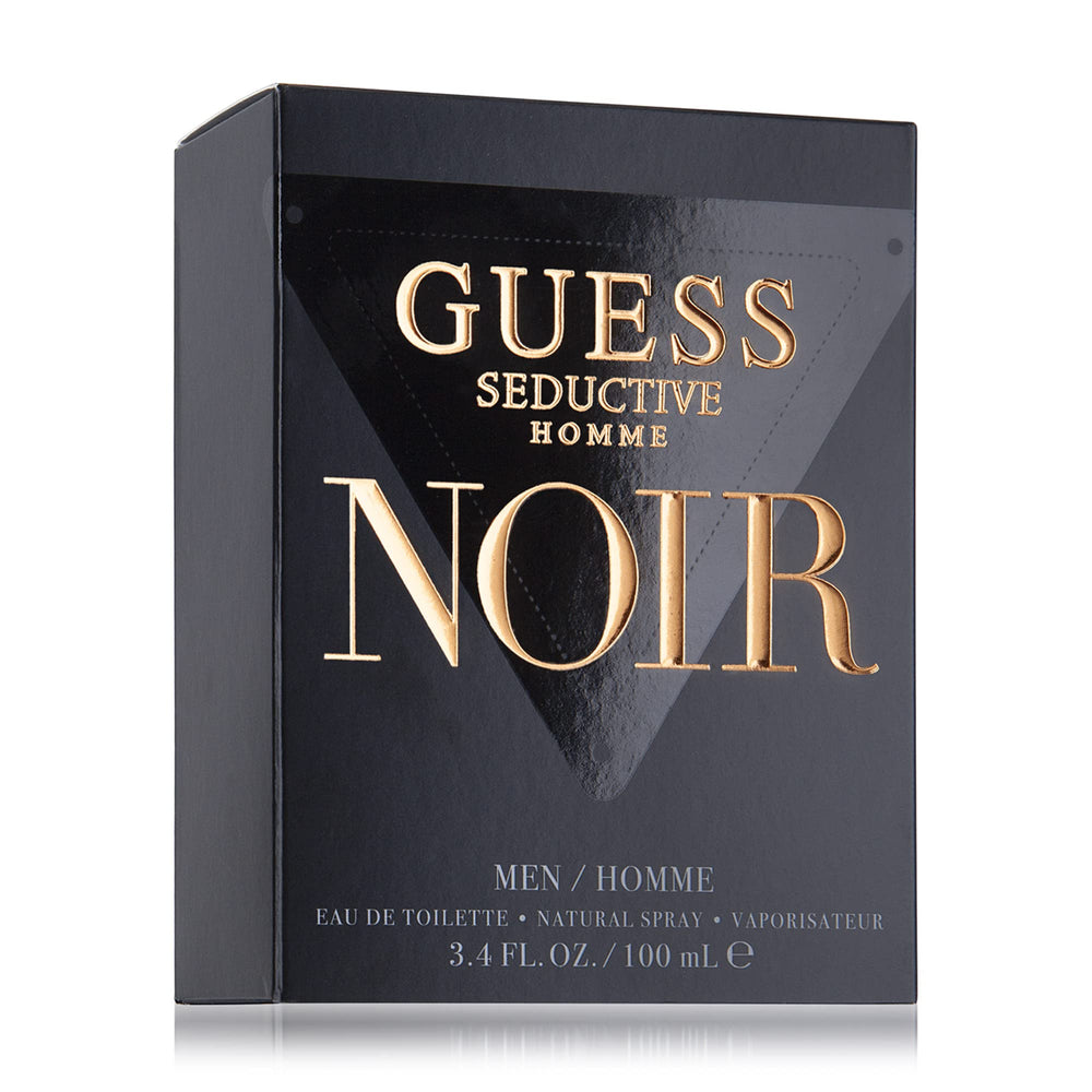 GUESS Seductive Homme Noir being sprayed from hand showing ease of application and evening use