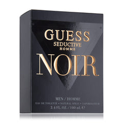 GUESS Seductive Homme Noir being sprayed from hand showing ease of application and evening use
