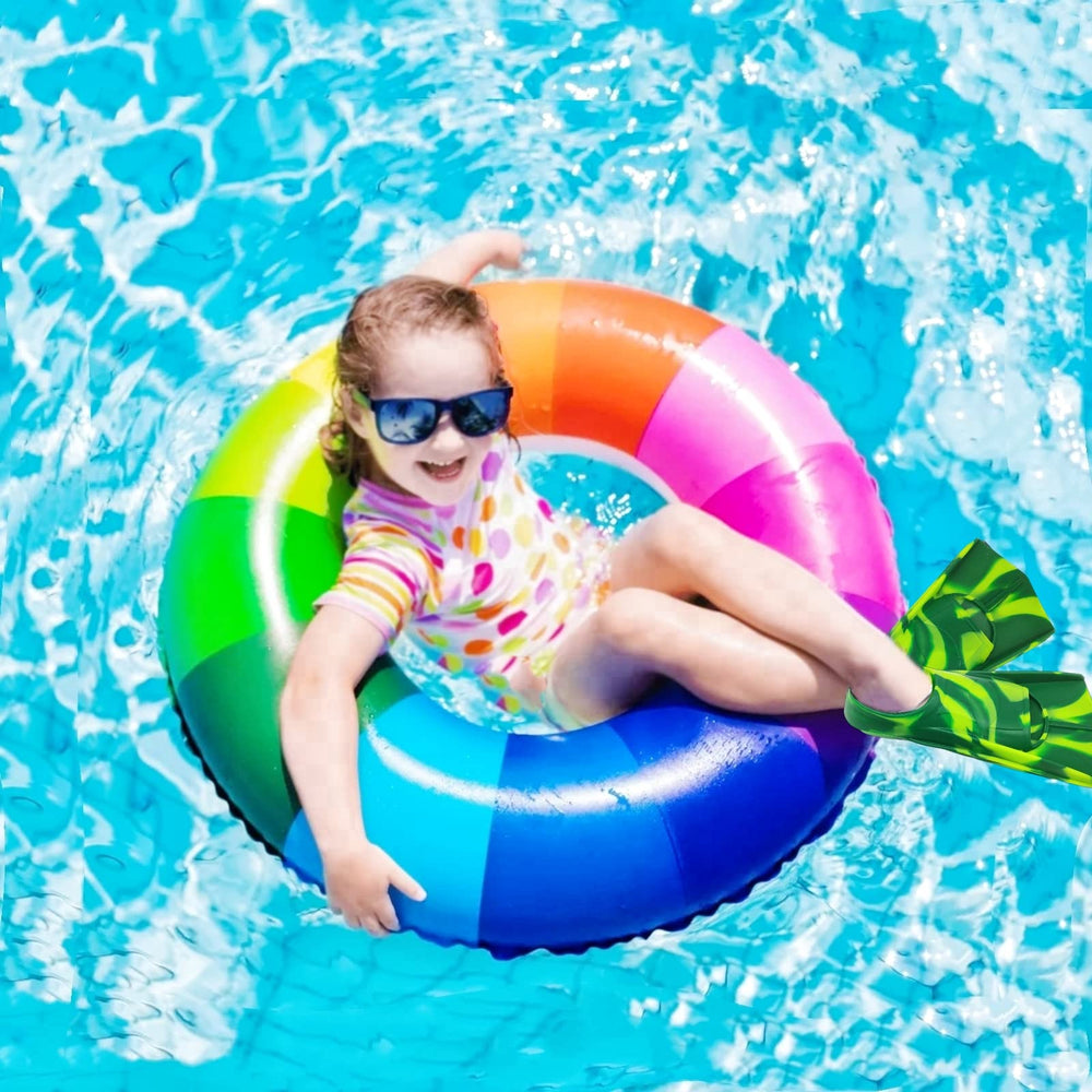 Gugmoy child wearing fins in pool showing improved kicking control