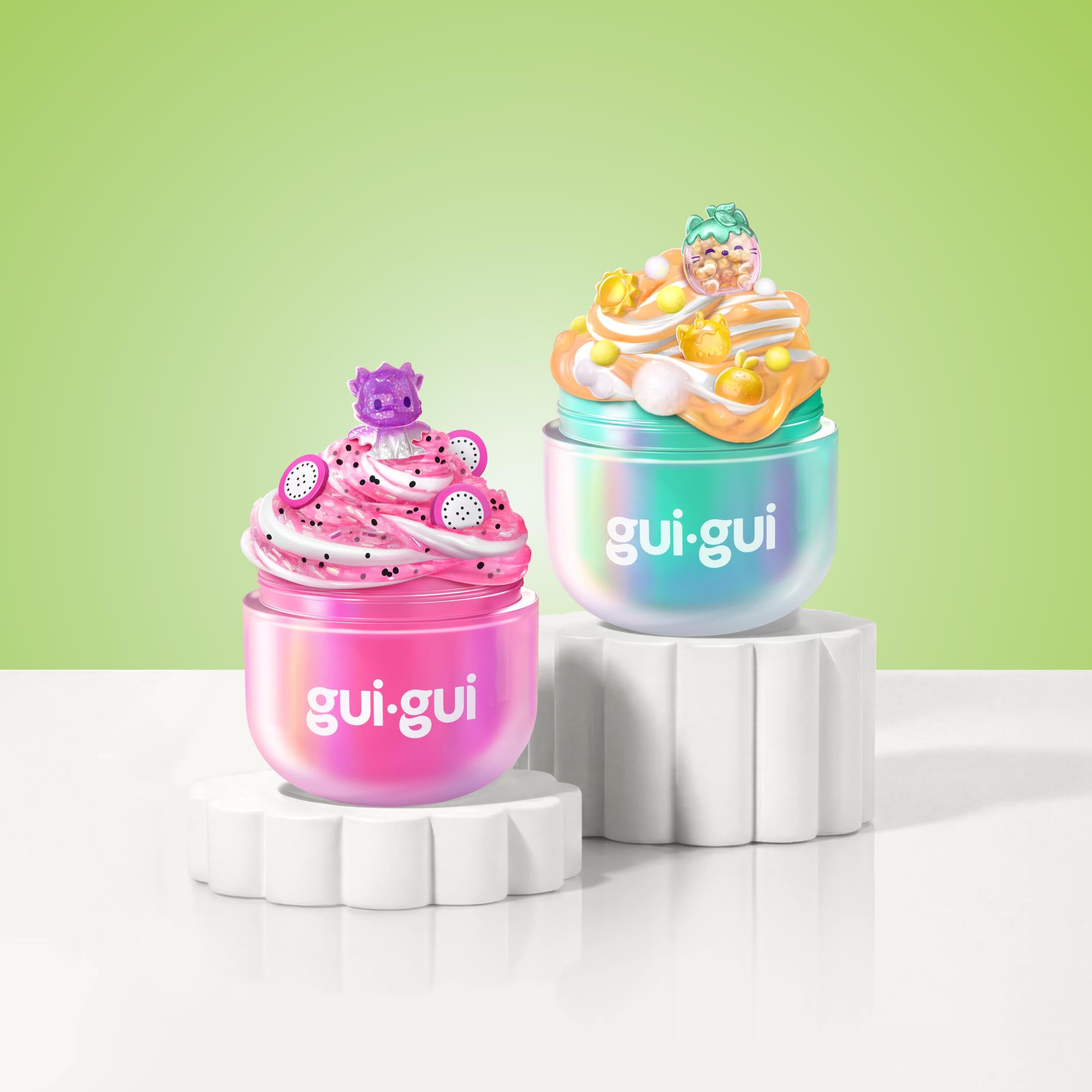 Gui Gui booster sachet and decorative charms laid out for customization and volume