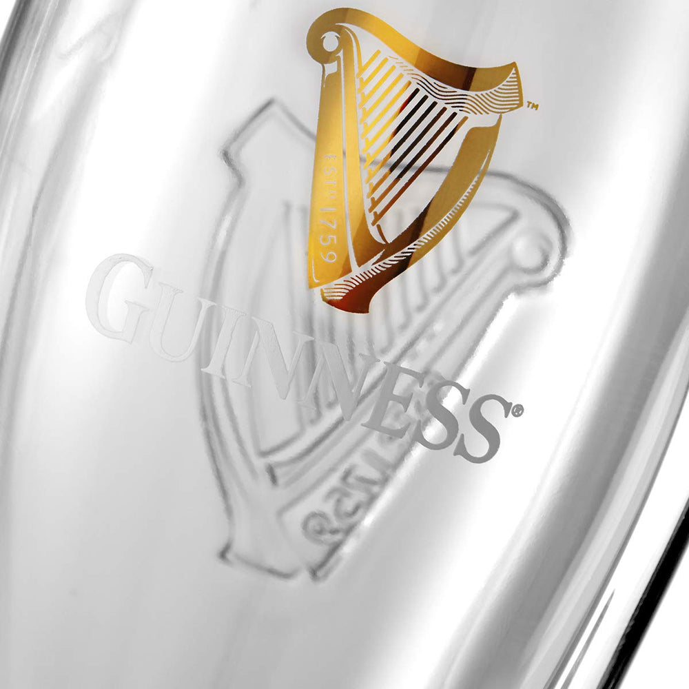 Guinness glass mid-pour demonstrating head formation and serving benefit