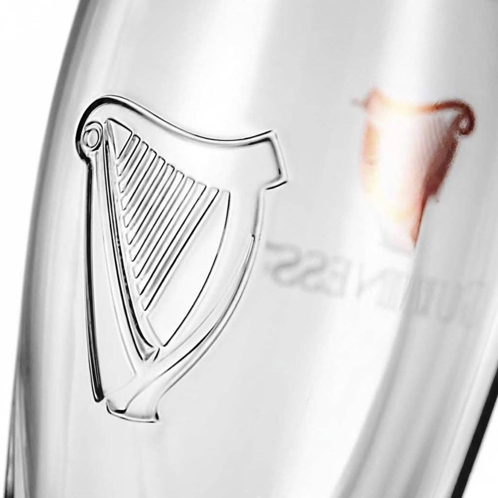 Guinness logo close-up on glass highlighting authentic branding and presentation benefit