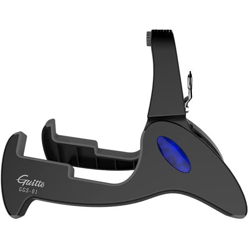 GUITTO compact folded stand beside hand for travel-friendly size benefit