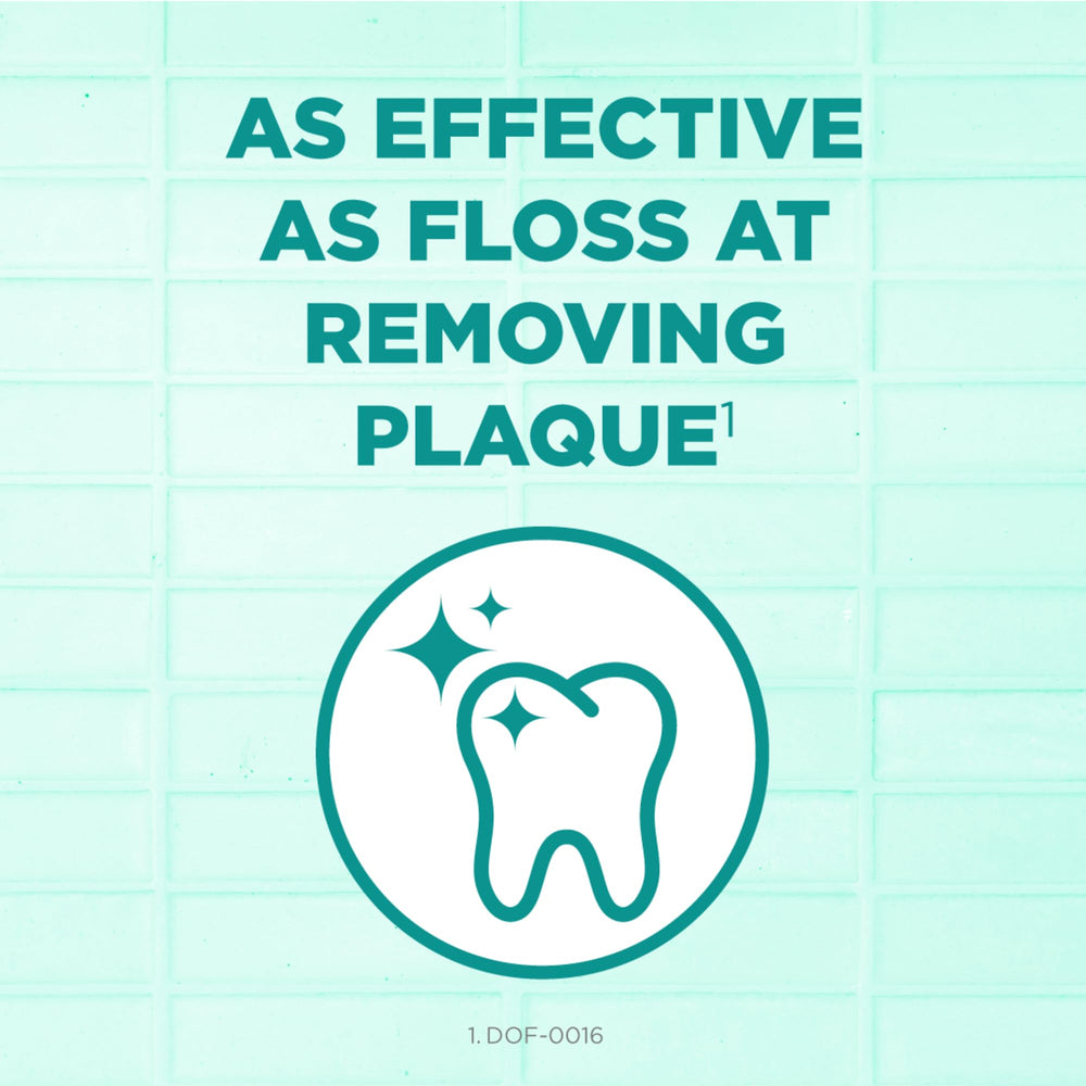 GUM pick sliding between teeth demonstrating quick food removal