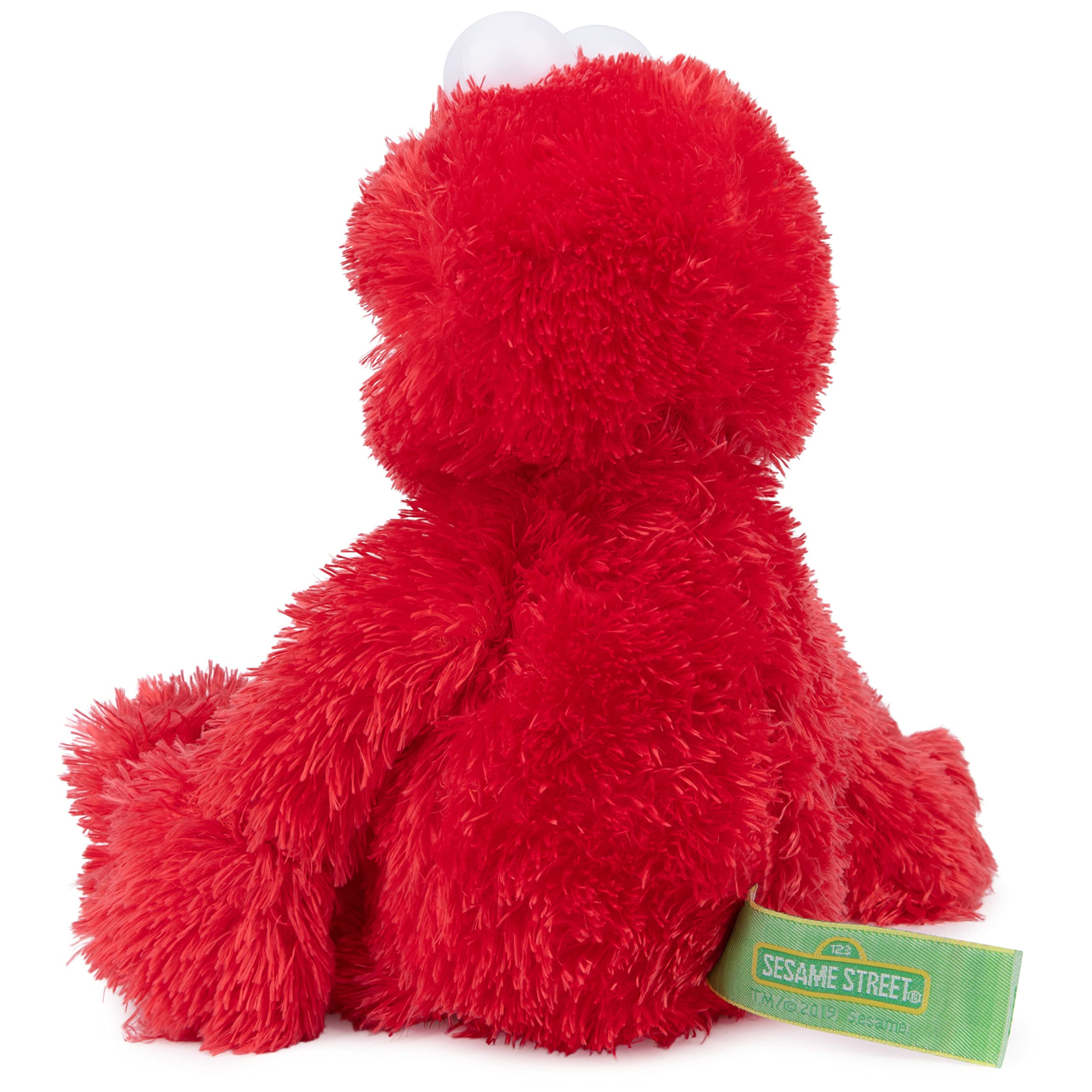 GUND Elmo in child's arms demonstrating comforting cuddle