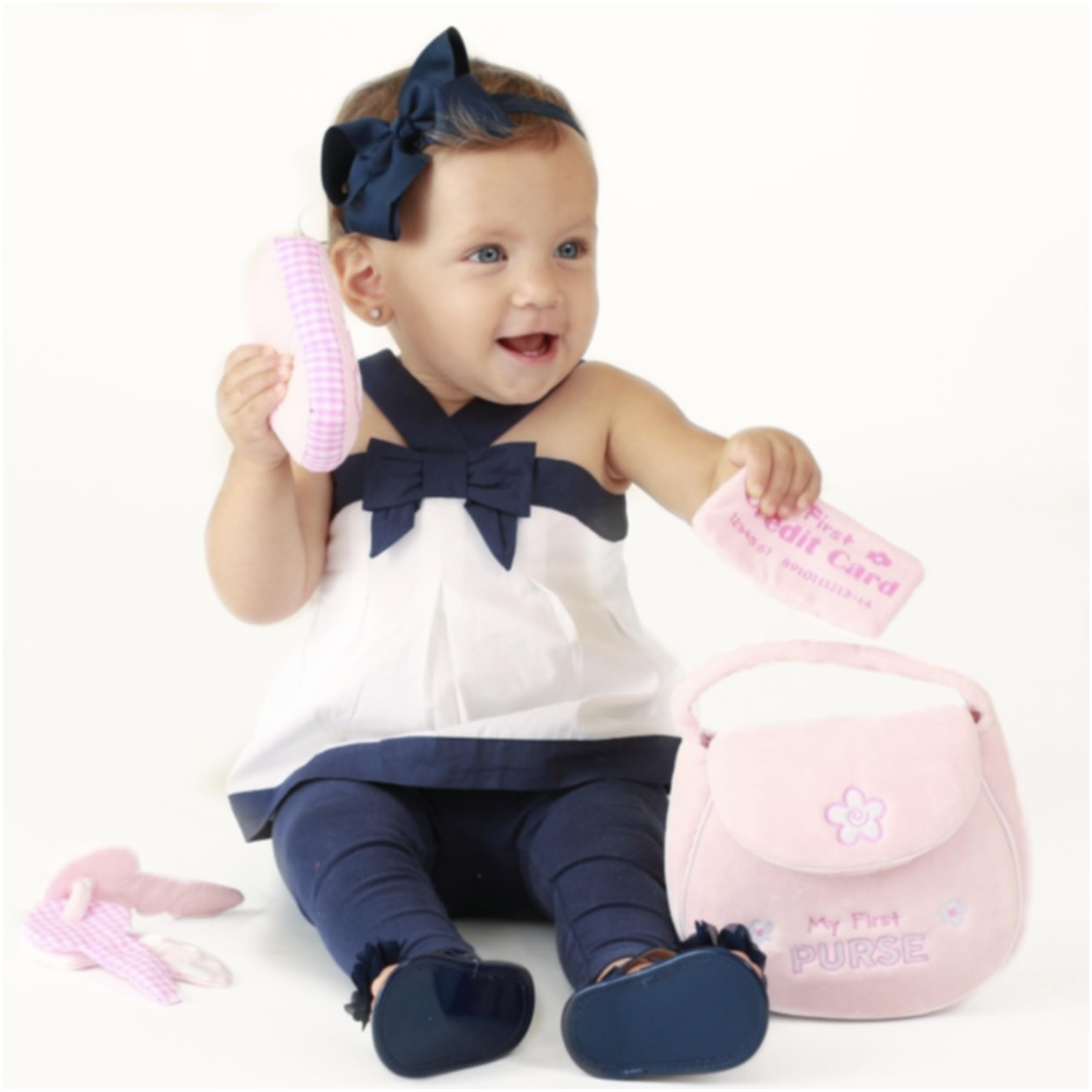 GUND open purse displaying four sensory toys for easy play organization