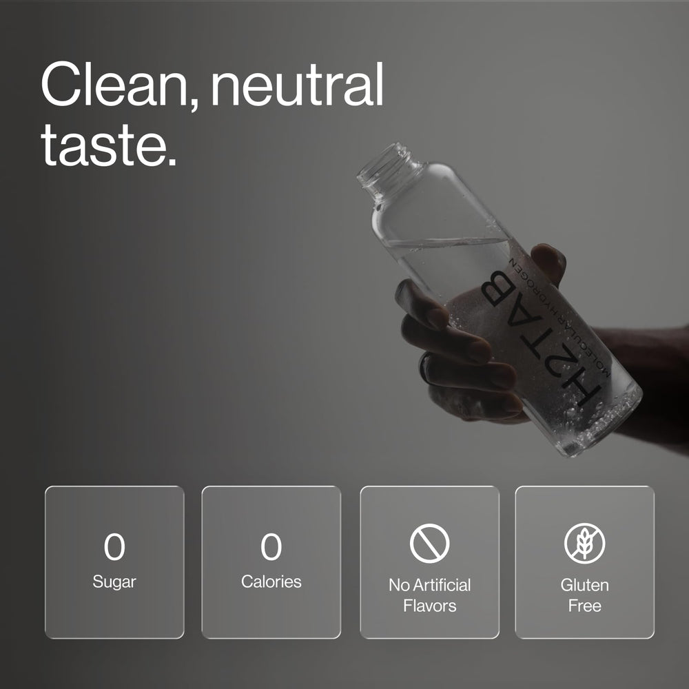 H2TAB tablet effervescing in a clear glass demonstrating fast hydrogen release