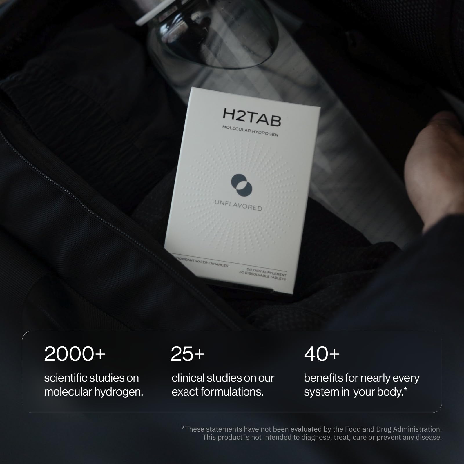 Person sipping H2TAB hydrogen water outdoors showing hydration on the go