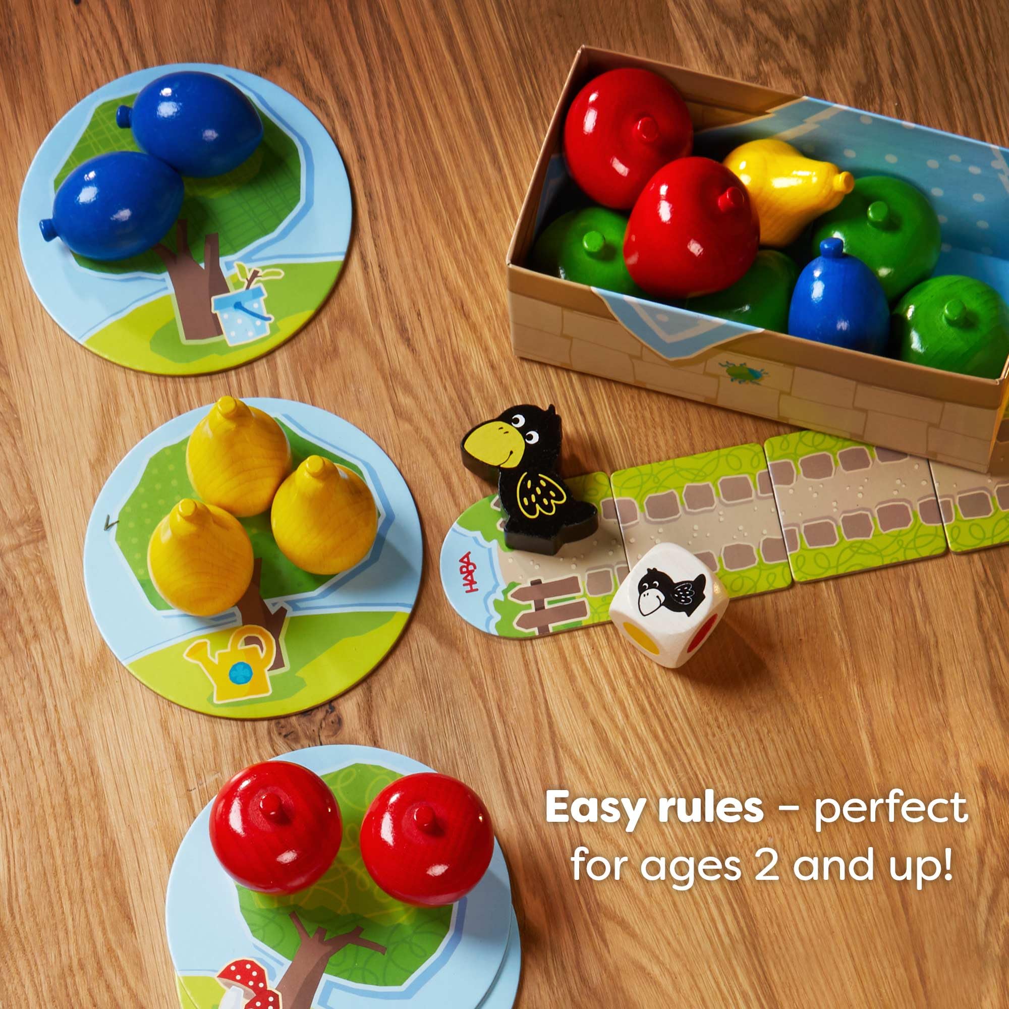 HABA First Orchard board layout with fruit spaces and raven track for clear play
