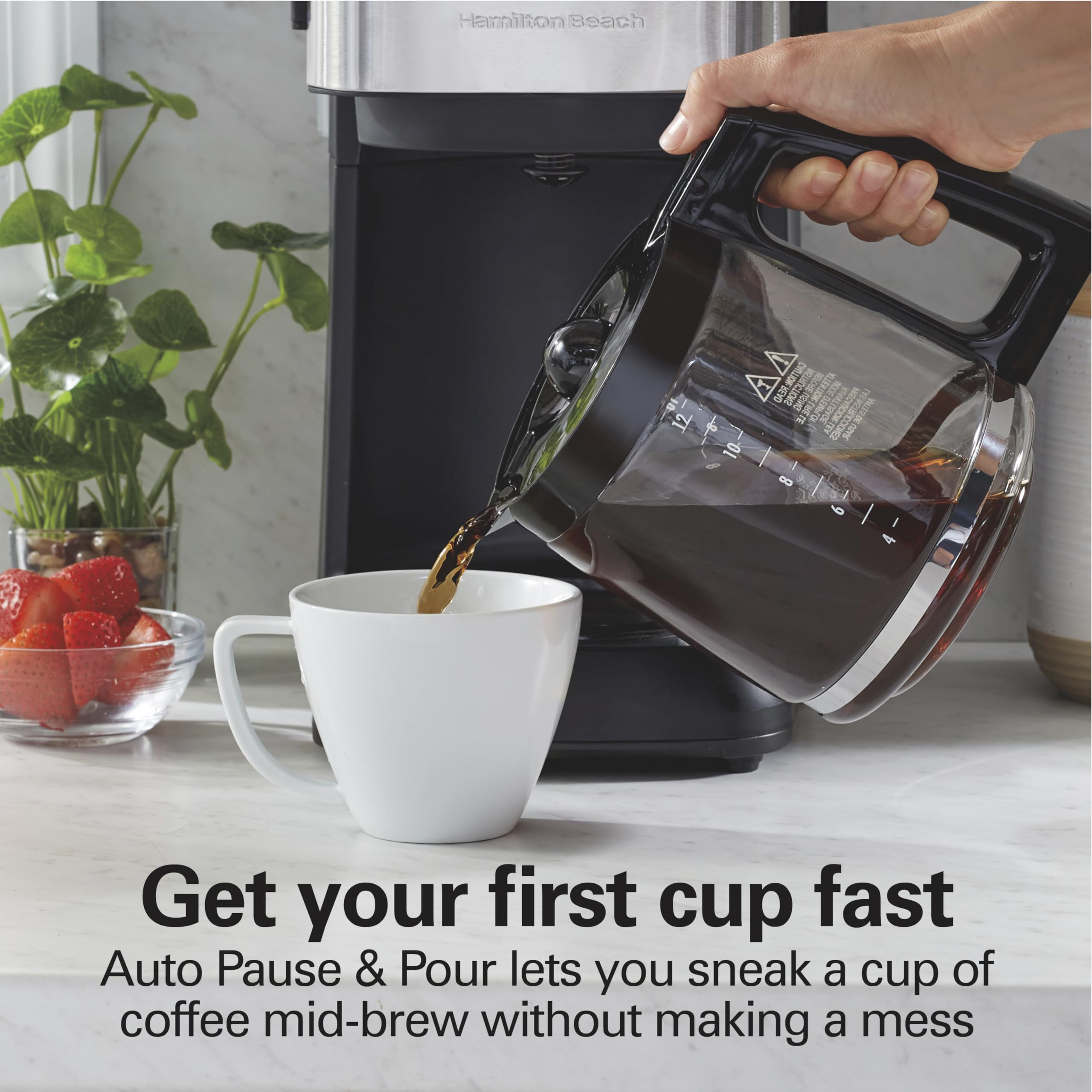 Hamilton Beach glass carafe pouring coffee with Auto Pause & Pour convenience