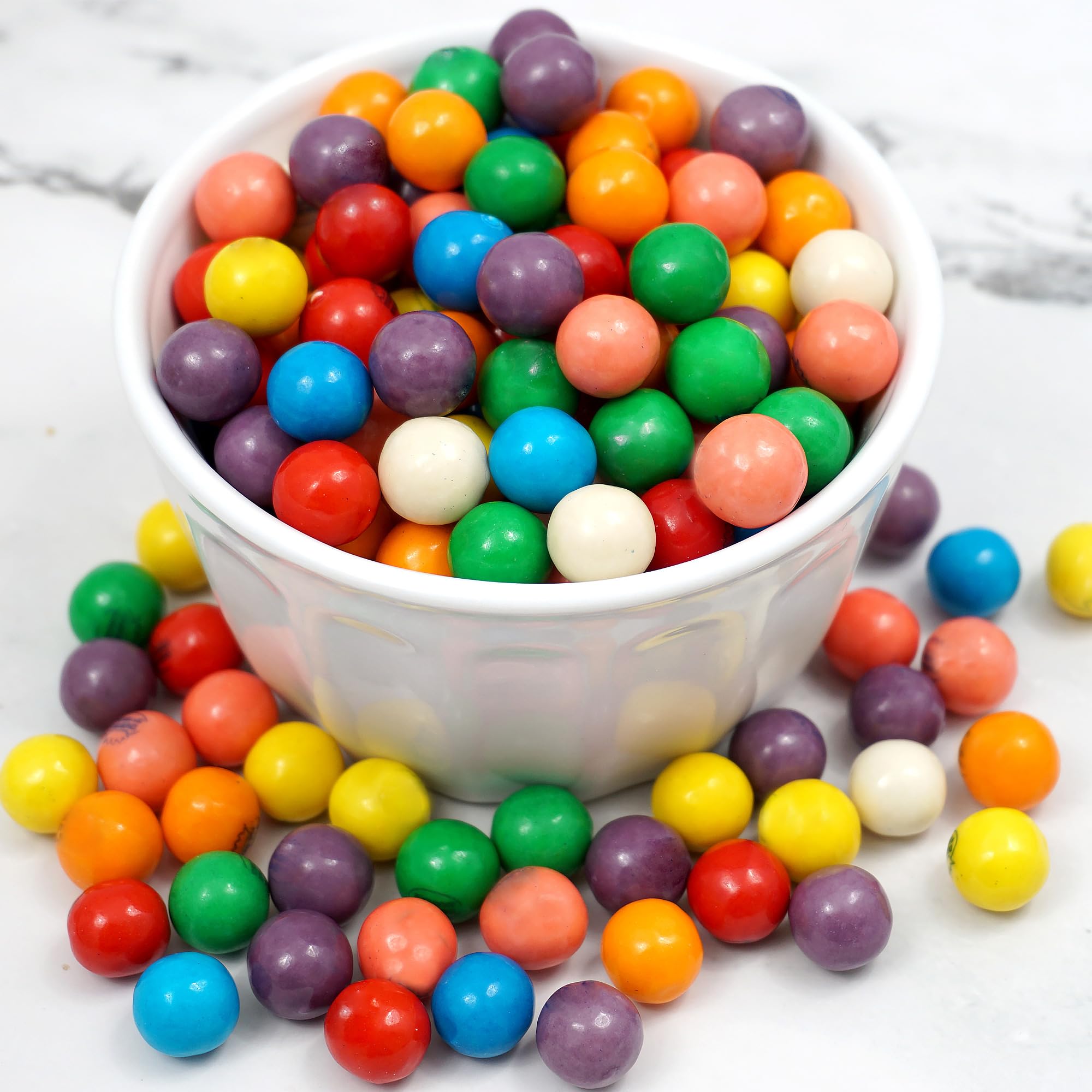 Hampton Popcorn mini gumballs dispensed from a tabletop gumball machine, demonstrating machine compatibility