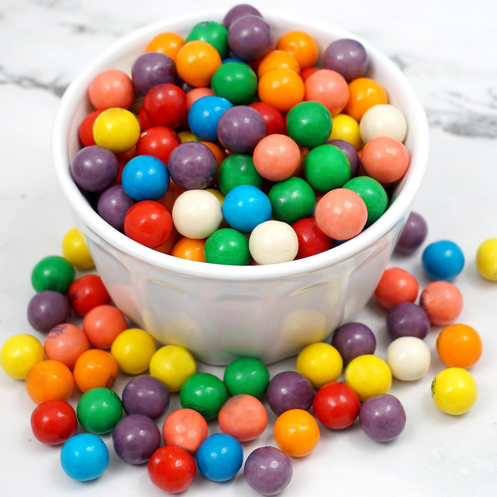 Hampton Popcorn mini gumballs dispensed from a tabletop gumball machine, demonstrating machine compatibility