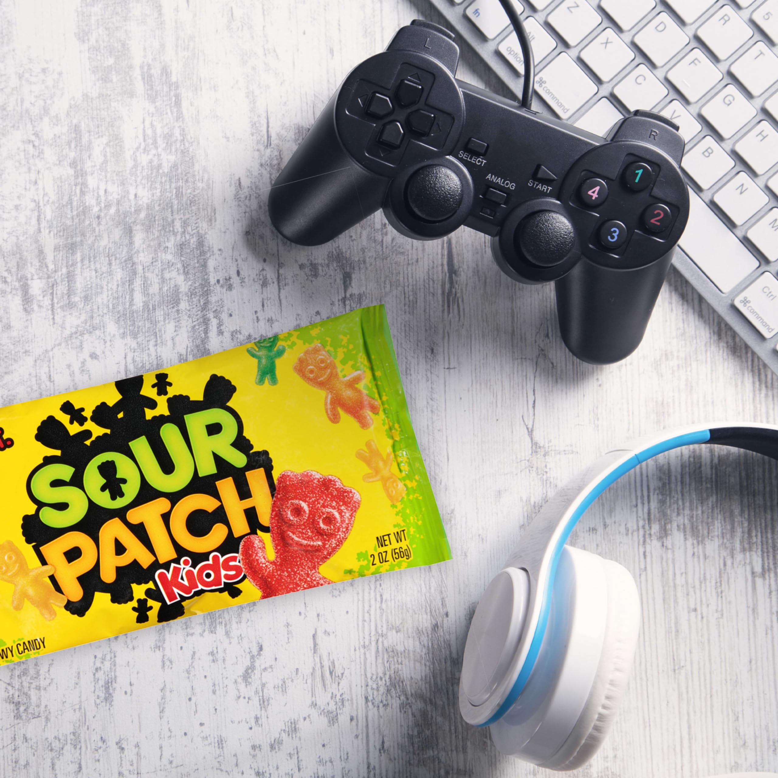 Hand holding a mini bag demonstrating portability of SOUR PATCH KIDS for travel