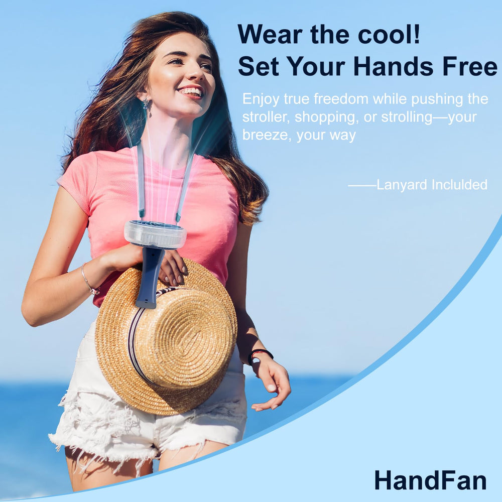 HandFan royal blue on beach lifestyle shot showing portable cooling for summer outings