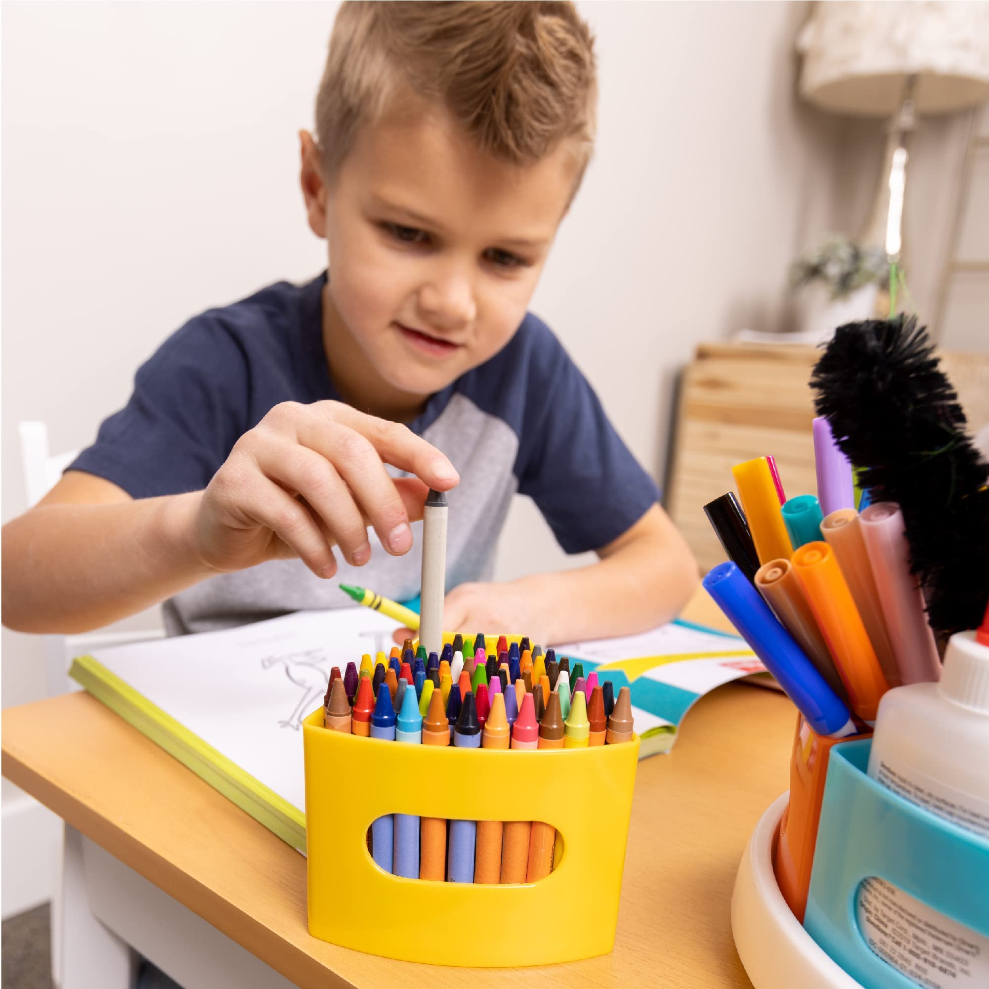 Hapinest caddy on classroom table with children crafting showing improved classroom workflow