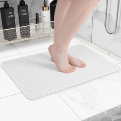 Hargiis front view of white bathtub mat showing size and clean design benefit