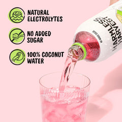 Harmless Harvest poured into a glass showing clear liquid and clean taste benefit