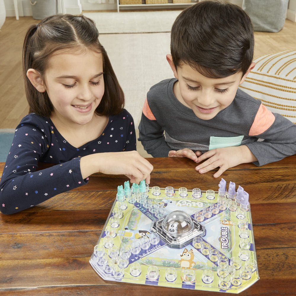 Hasbro Gaming family playing outdoors for travel-friendly entertainment