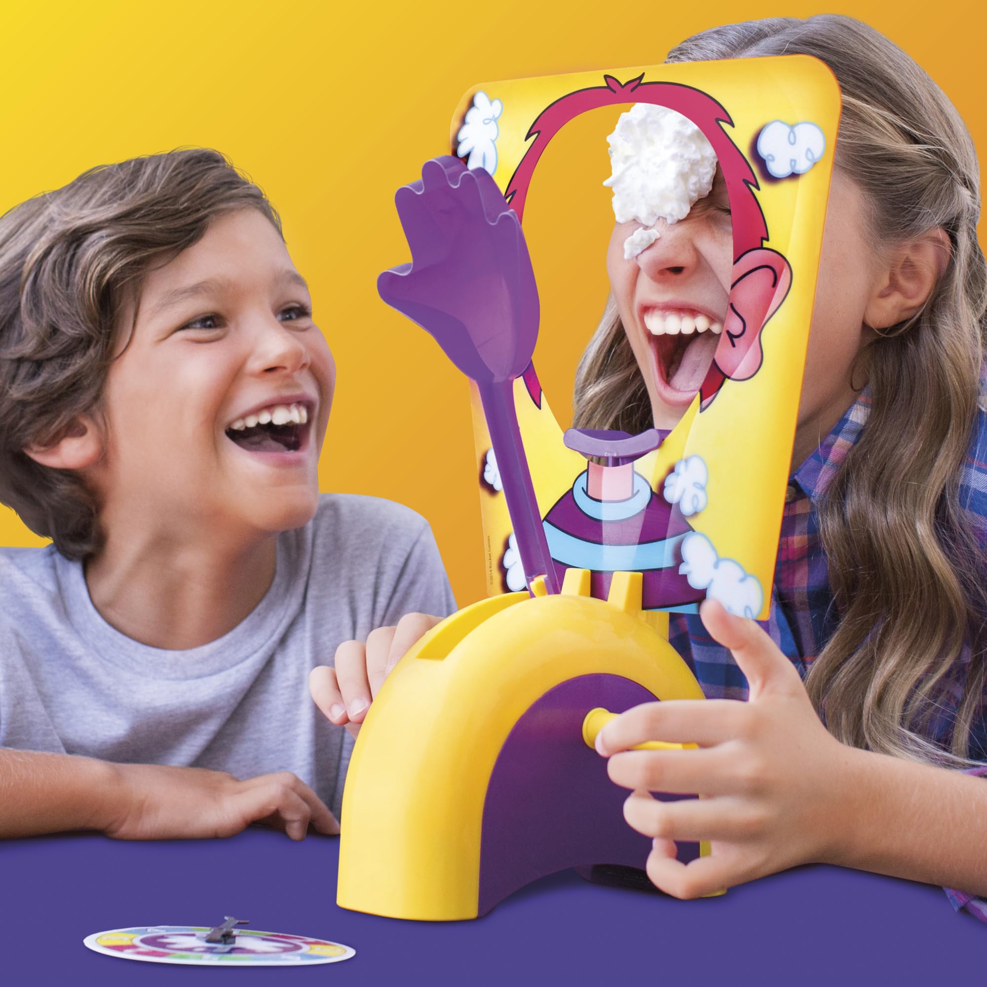 Hasbro Gaming close-up of spring-loaded throwing hand showing suspenseful action