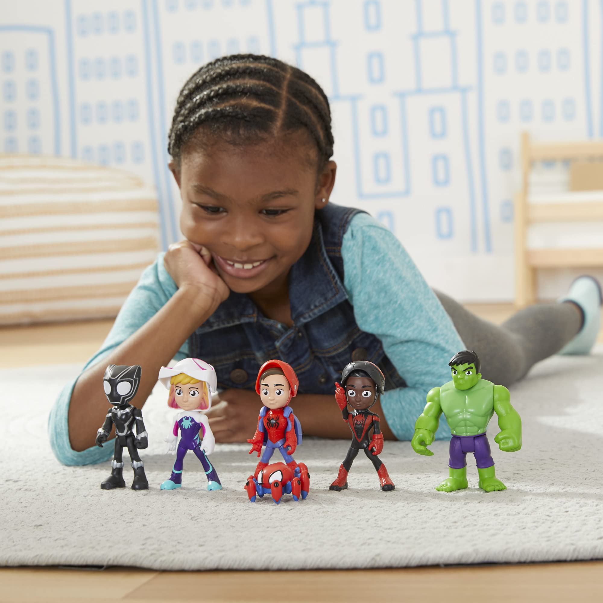 Hasbro child playing with figures demonstrating hands-on creative play