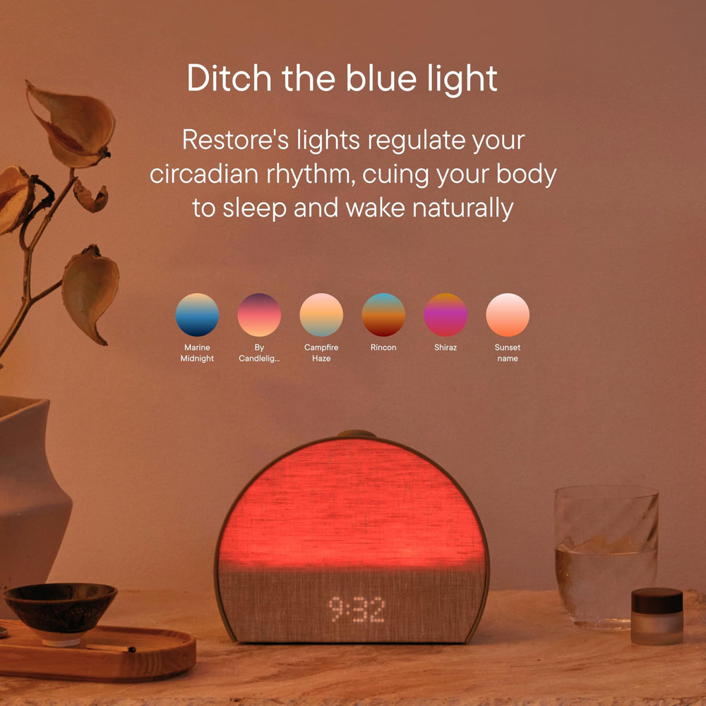 Hatch Restore 3 next to smartphone to show compact scale and portability