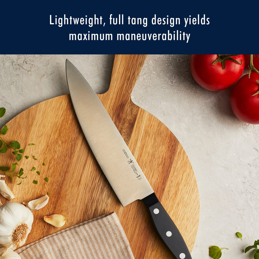 HENCKELS triple-rivet handle close-up showing ergonomic grip and balanced control