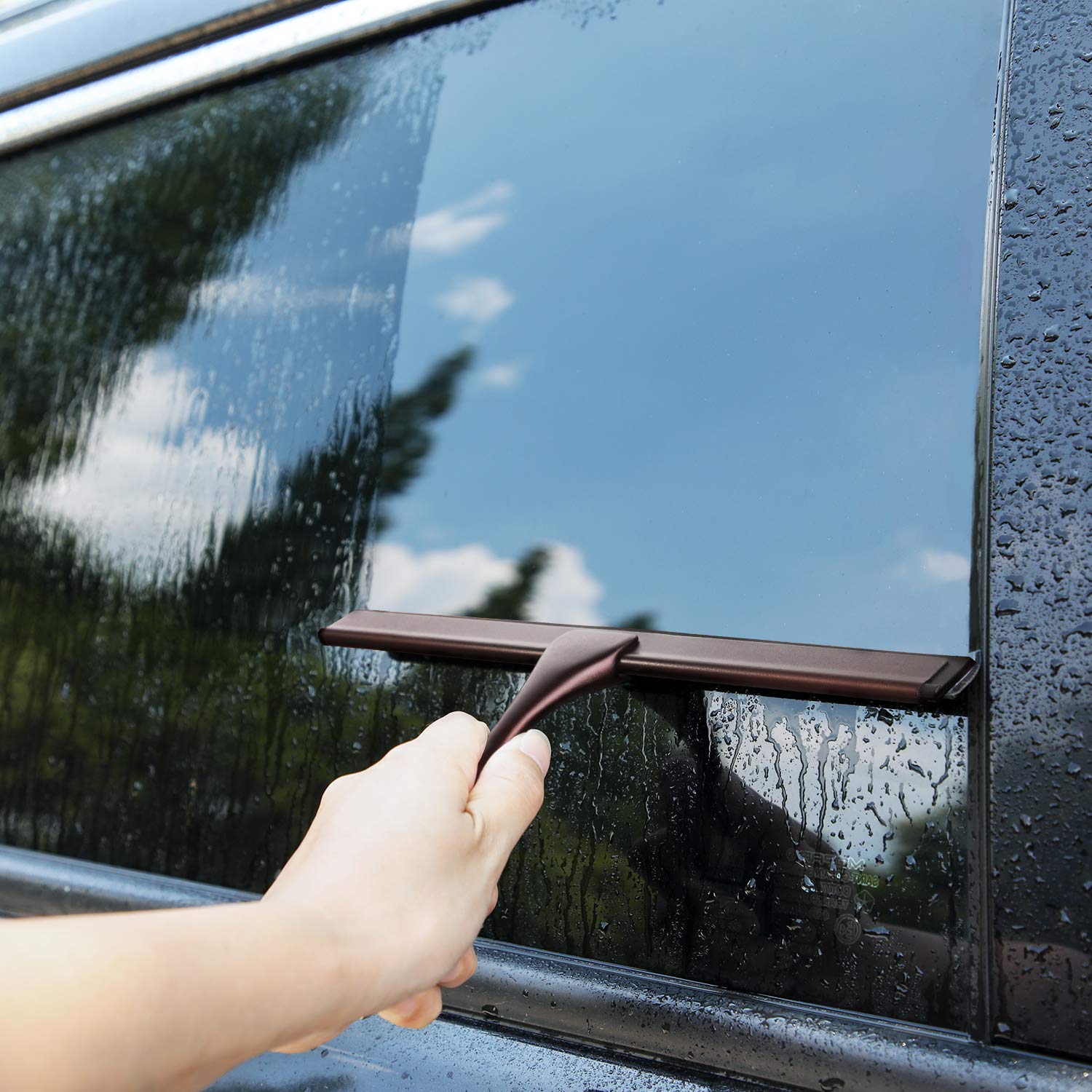 HIWARE squeegee clearing a car windshield highlighting streak-free visibility outdoors