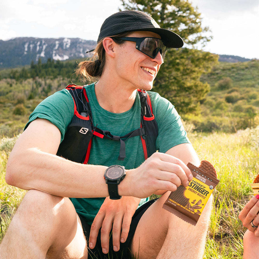 Honey Stinger waffle in cycling jersey pocket demonstrating on-the-go fueling