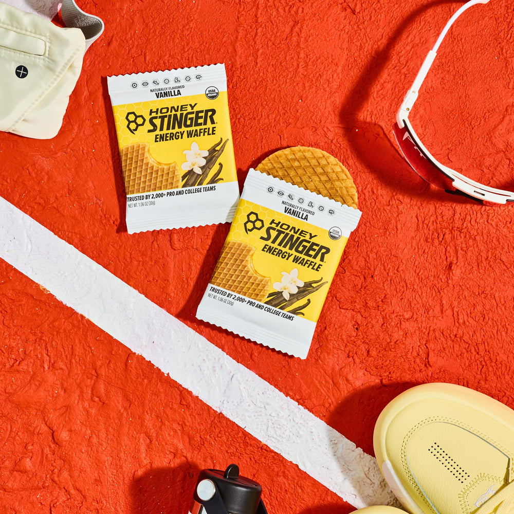 Honey Stinger waffle on a running trail demonstrating portable energy