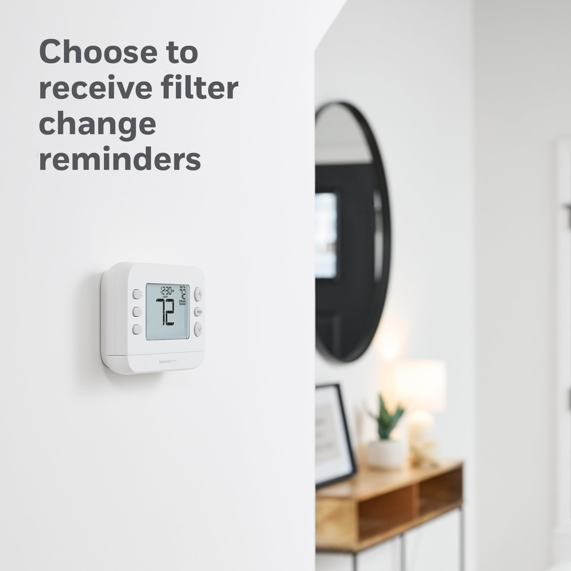 Honeywell Home installed on wall to demonstrate size and room scale context