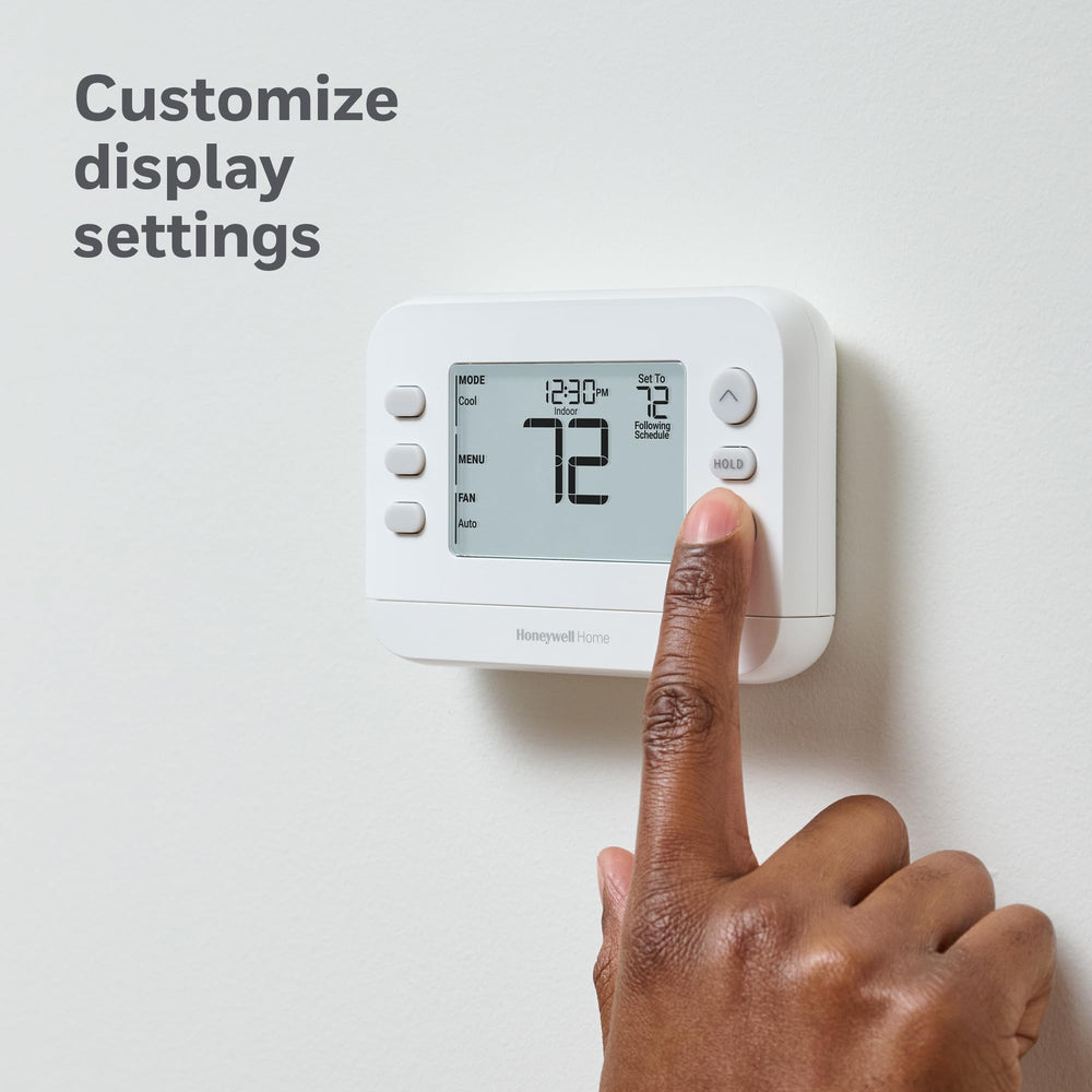 Honeywell Home thermostat in kitchen setting illustrating comfortable home climate
