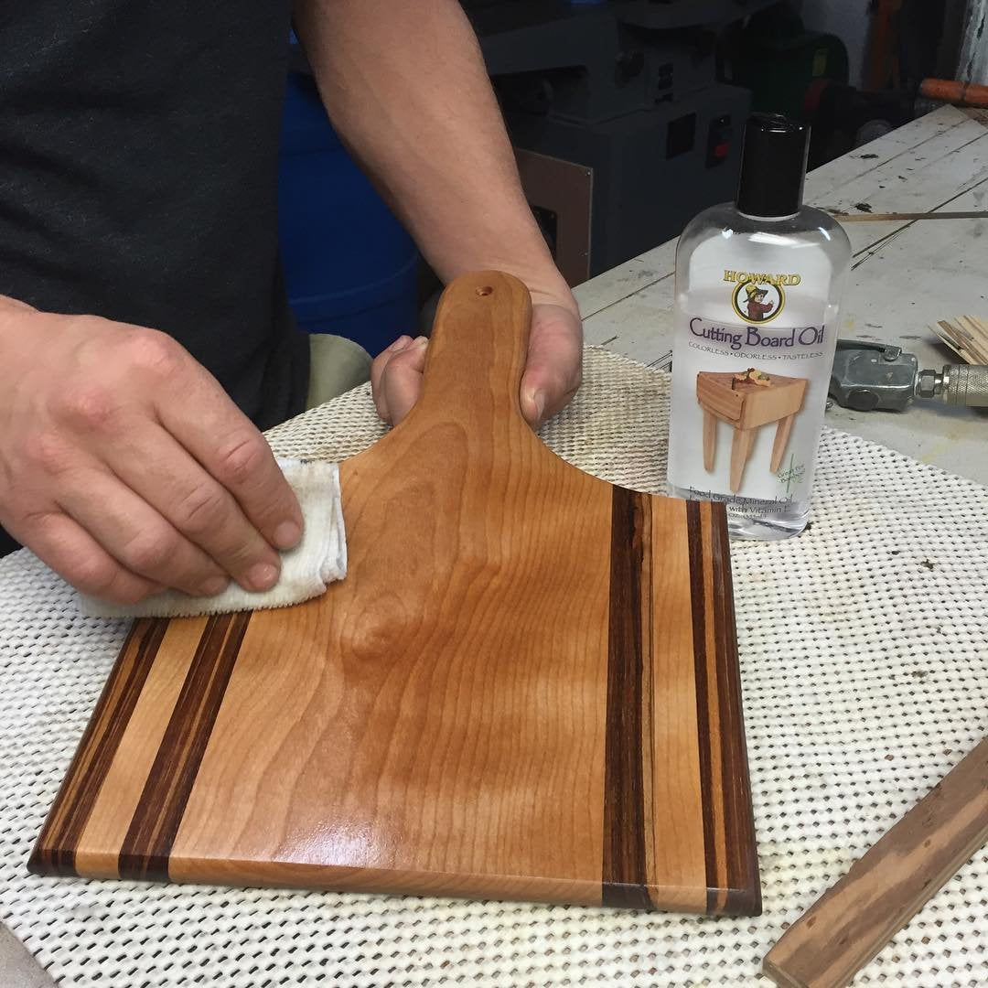 HOWARD applicator cloth spreading oil for easy, even coverage