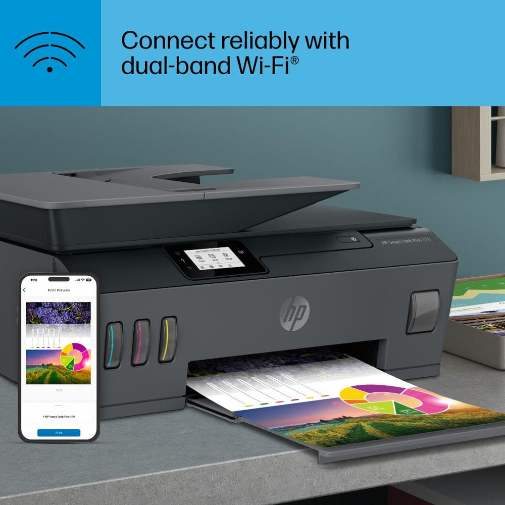 HP Smart Tank Plus 570 next to a laptop showing scale and suitability for home office setups