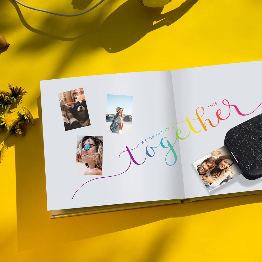 HP Sprocket printed photo being peeled and stuck on a notebook showcasing easy adhesive application