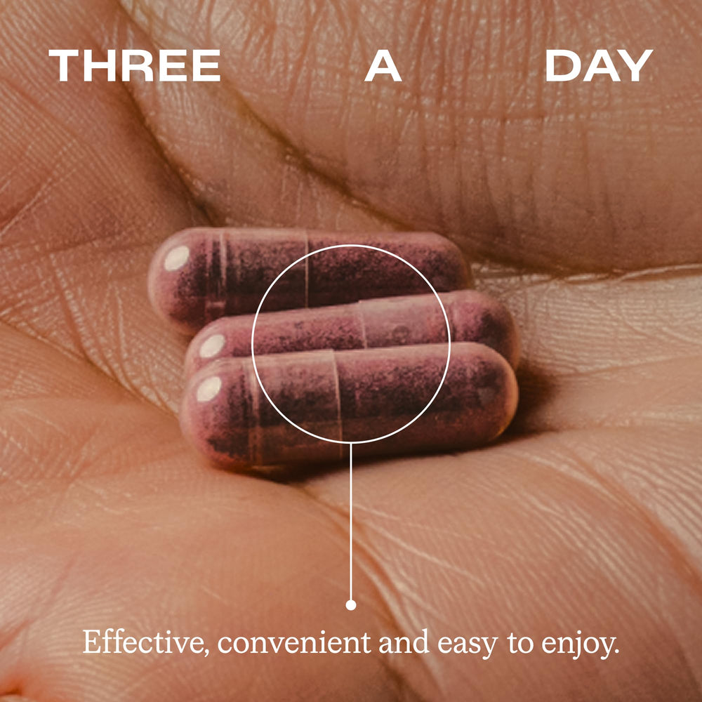 HumanN bottle beside a standard vitamin bottle for size comparison