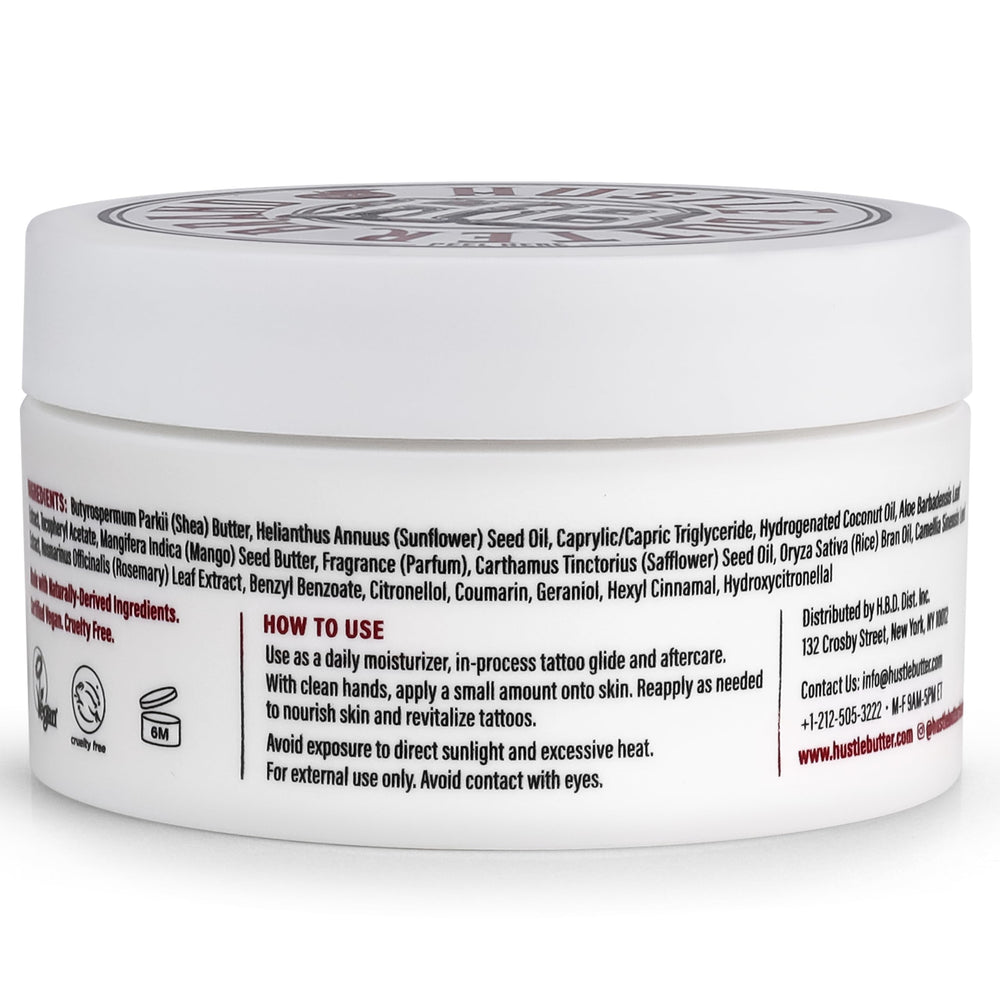 Hustle Butter Deluxe jar on bathroom counter in lifestyle setting for daily tattoo care routine