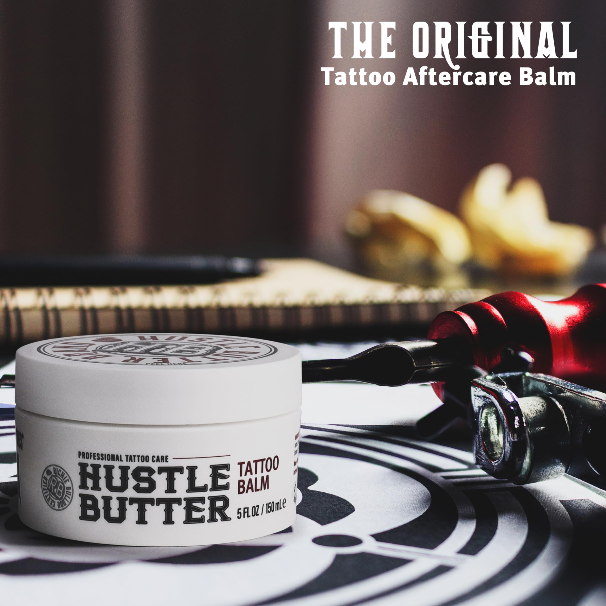 Open jar of Hustle Butter Deluxe revealing creamy contents to moisturize and protect tattoos