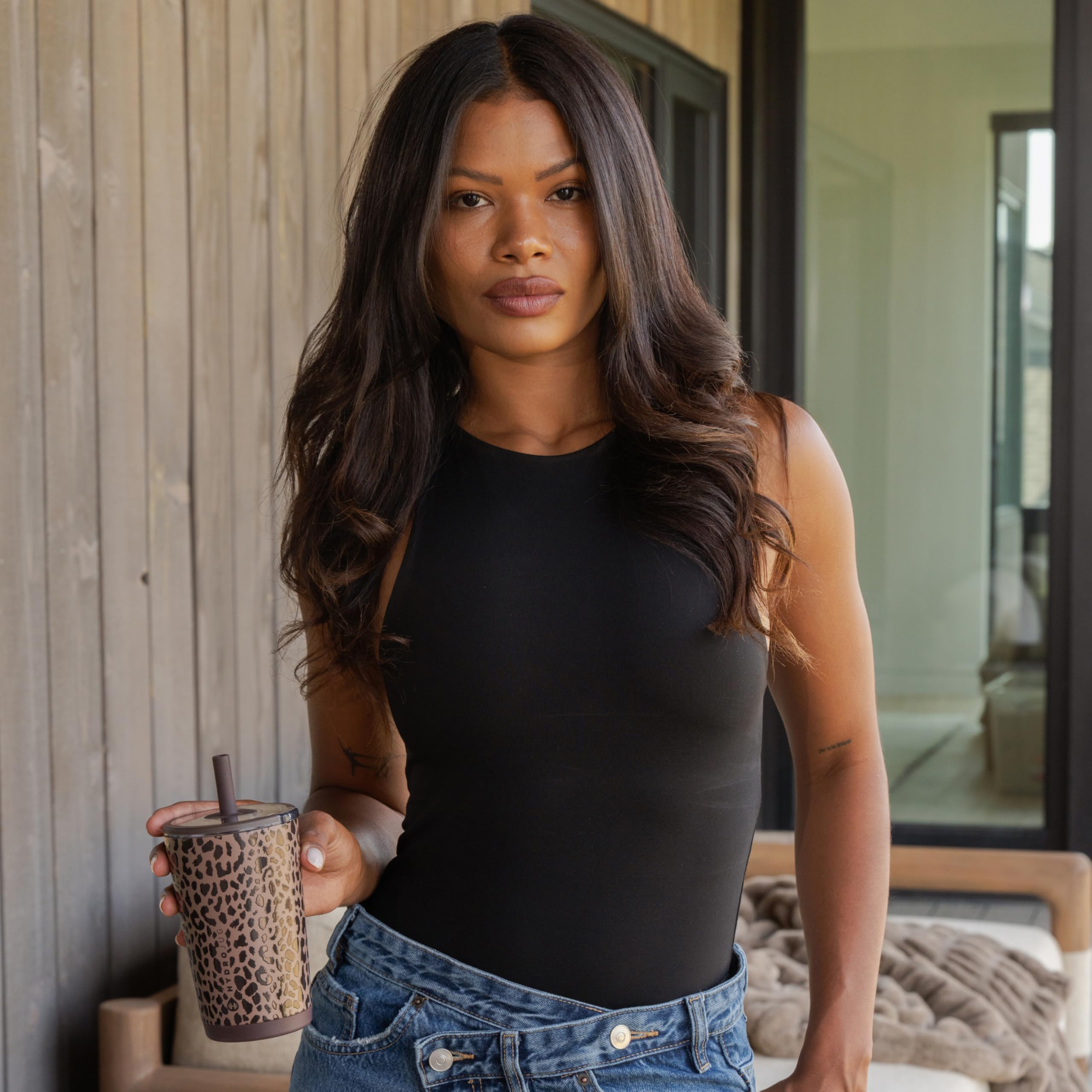HydroJug lifestyle image with coffee on desk showing everyday use and style