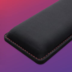 HyperX wrist rest underside showing natural rubber anti-slip grip for desk stability