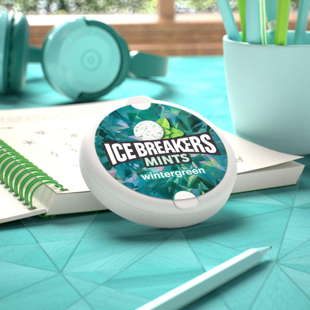 Ice Breakers tins on desk showing workplace freshness and shared supply benefit