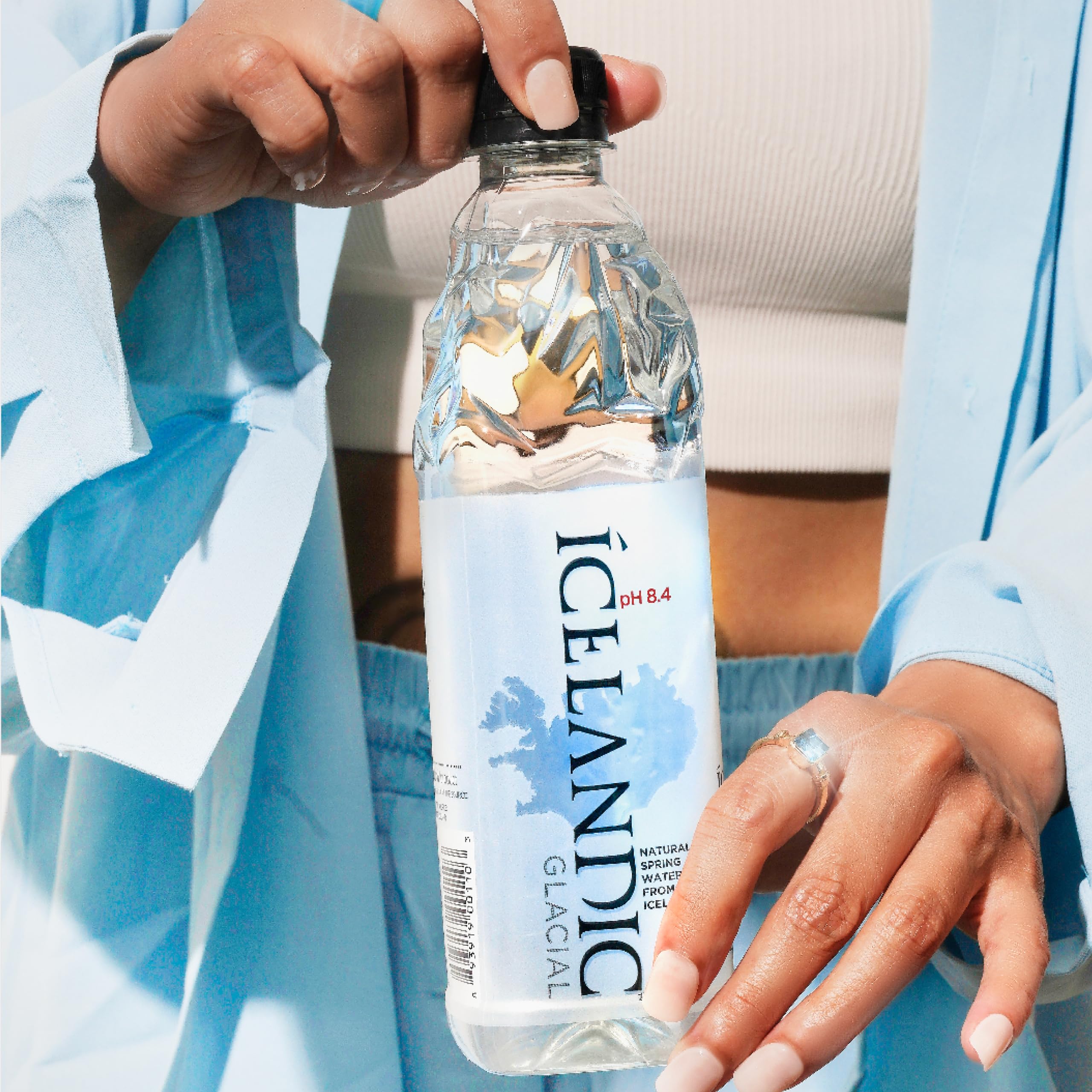 Icelandic Glacial bottle paired with a snack, suggests meal pairing and neutral taste