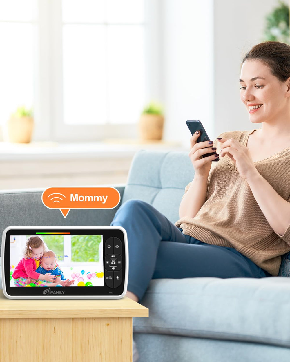iFamily parent unit held in hand showing compact size and easy portability benefit