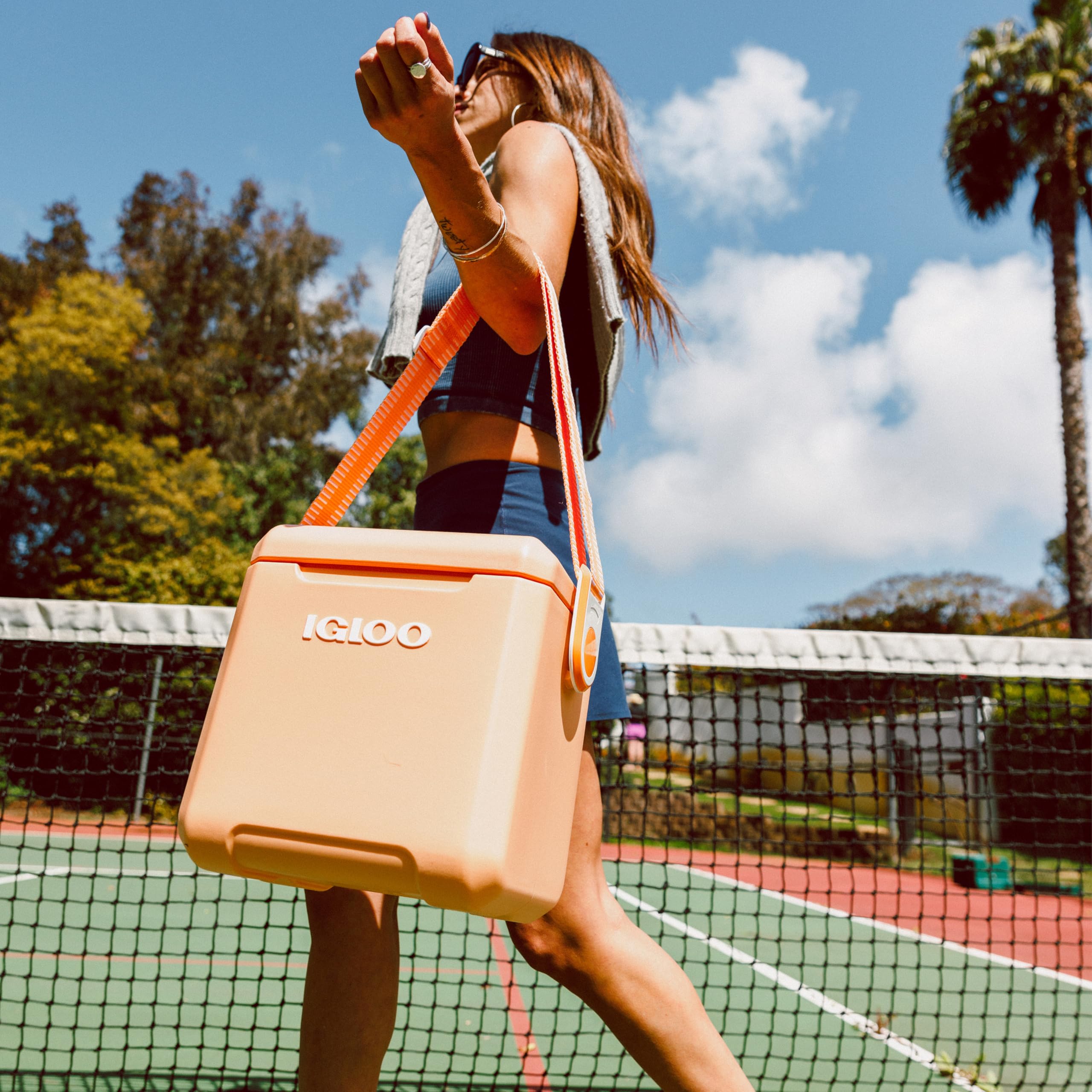 Igloo Tag Along Too worn crossbody in a lifestyle scene for active, on-the-go use
