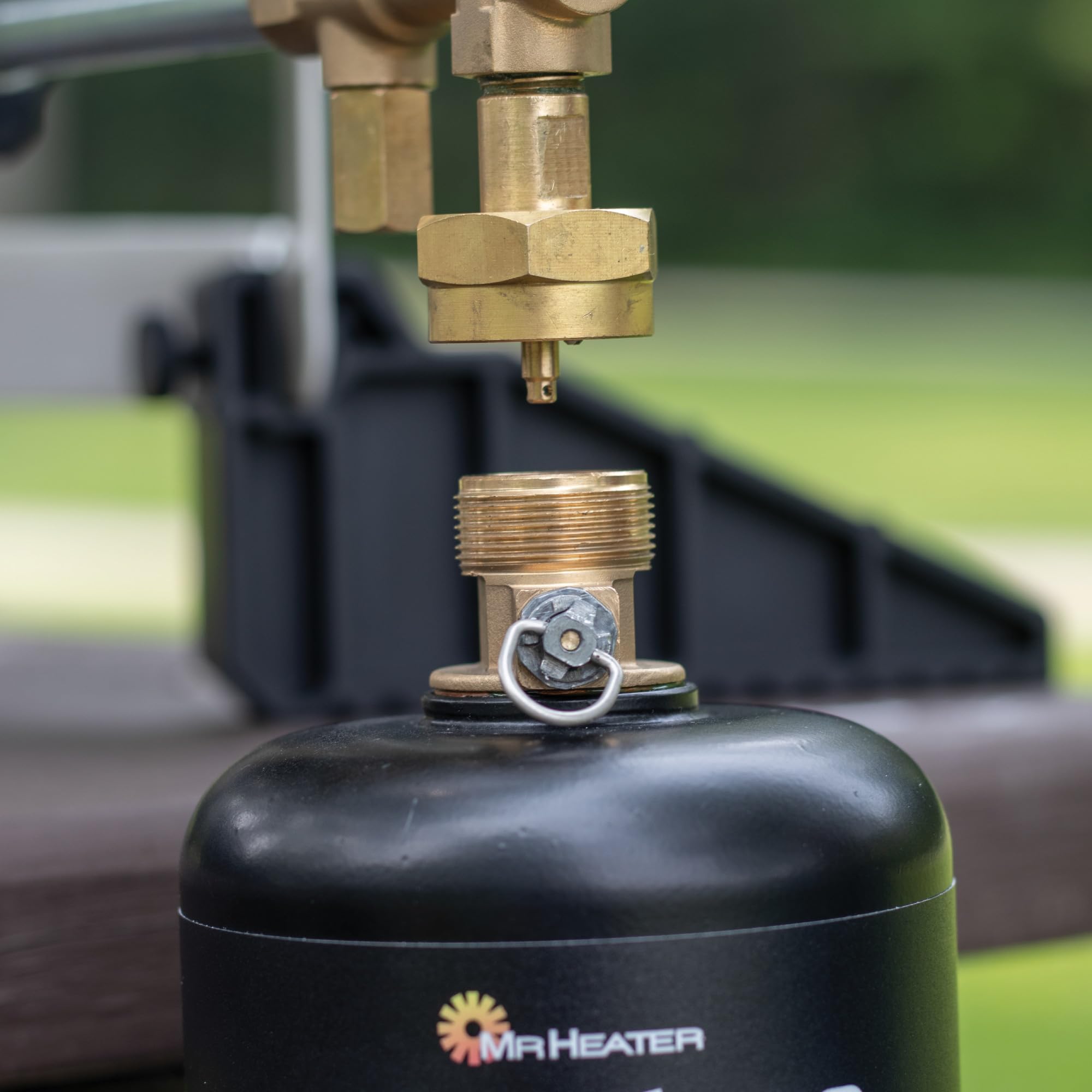 Close-up of a Mr. Heater cylinder valve and refill connection.