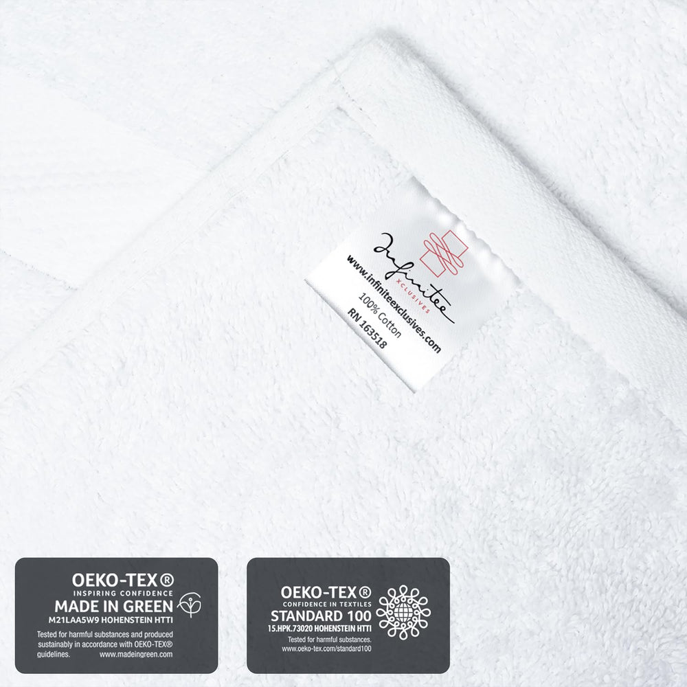 Infinitee Xclusives folded towel beside a ruler for size and scale comparison